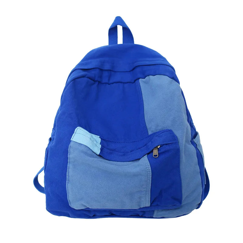 Blue backpack with a front pocket on a white background
