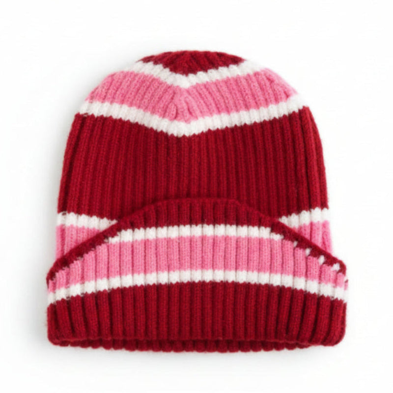 Striped red, pink, and white beanie on a white background