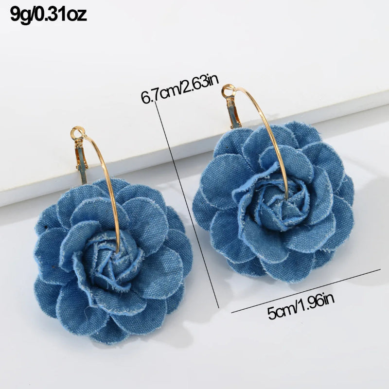 Blue flower-shaped earrings with gold hooks, shown with measurements on a white background.