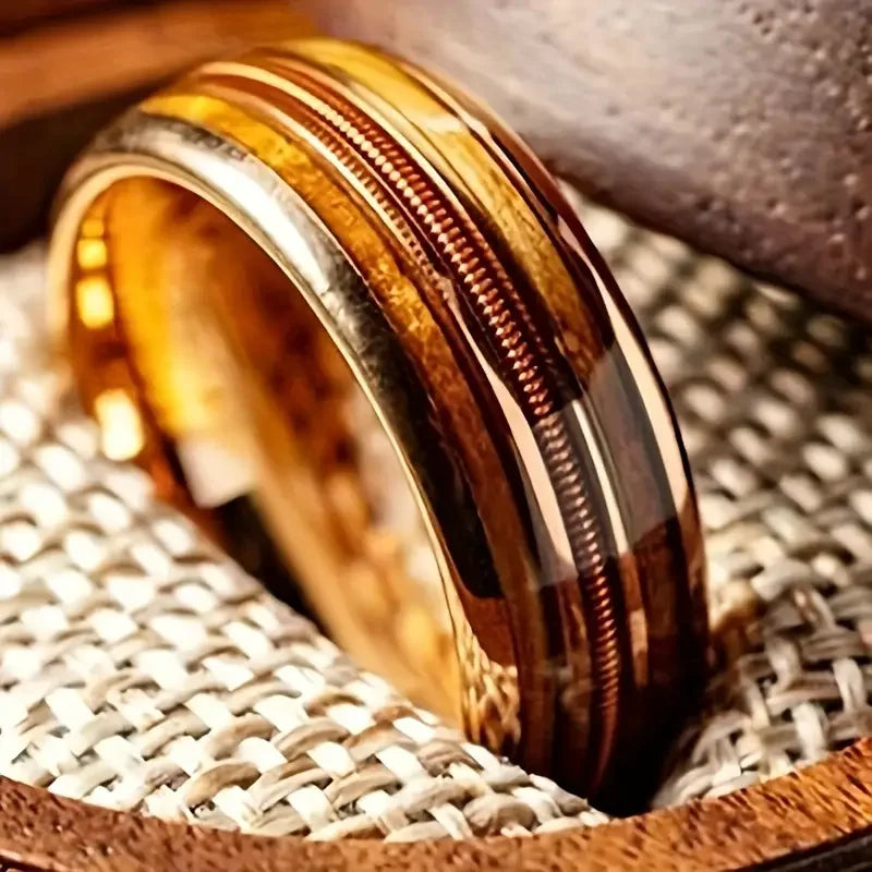 Bronze-toned ring on a textured surface