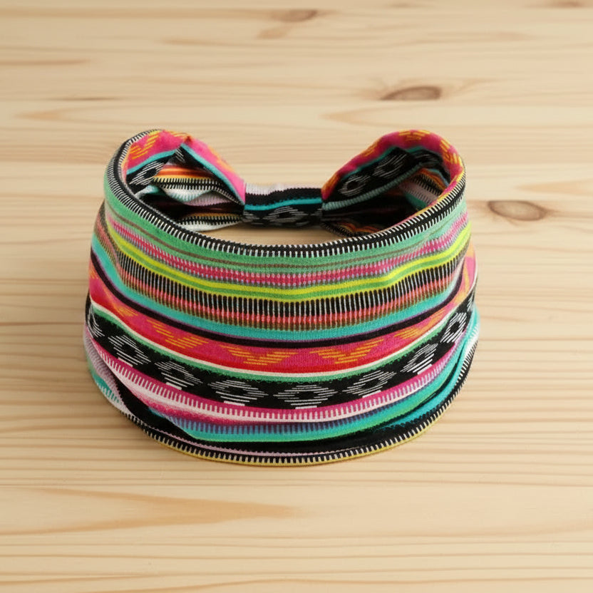Colorful striped headband on a wooden surface