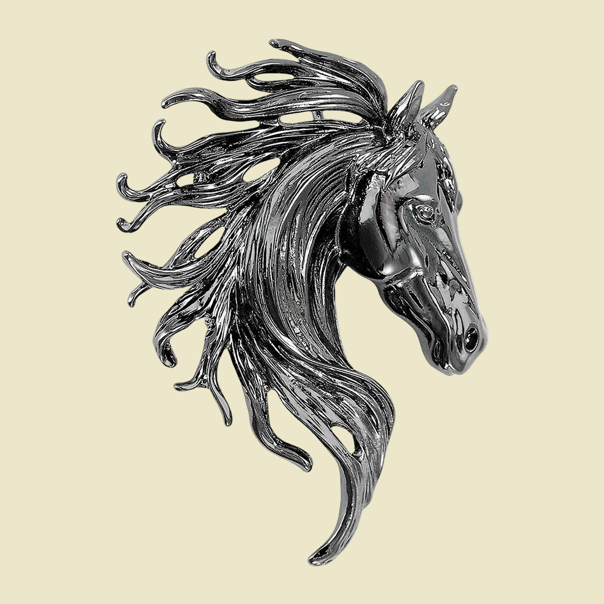 Silver horse head sculpture on a cream-colored background
