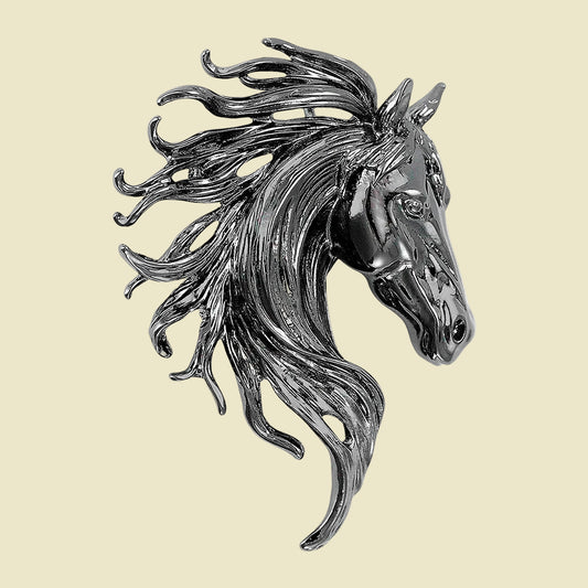 Silver horse head sculpture on a cream-colored background