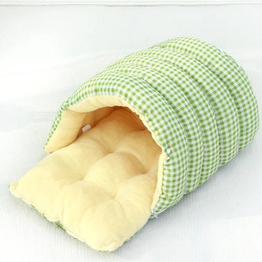 Green and white checkered pet bed with beige interior on a white background