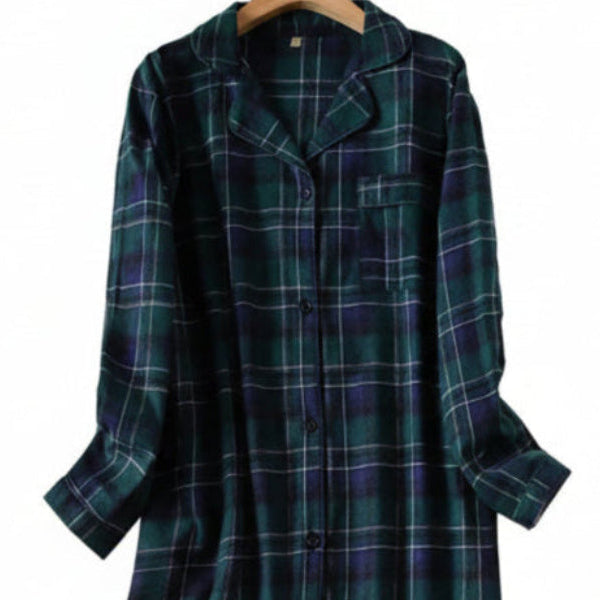 Green plaid night shirt on a hanger against a white background