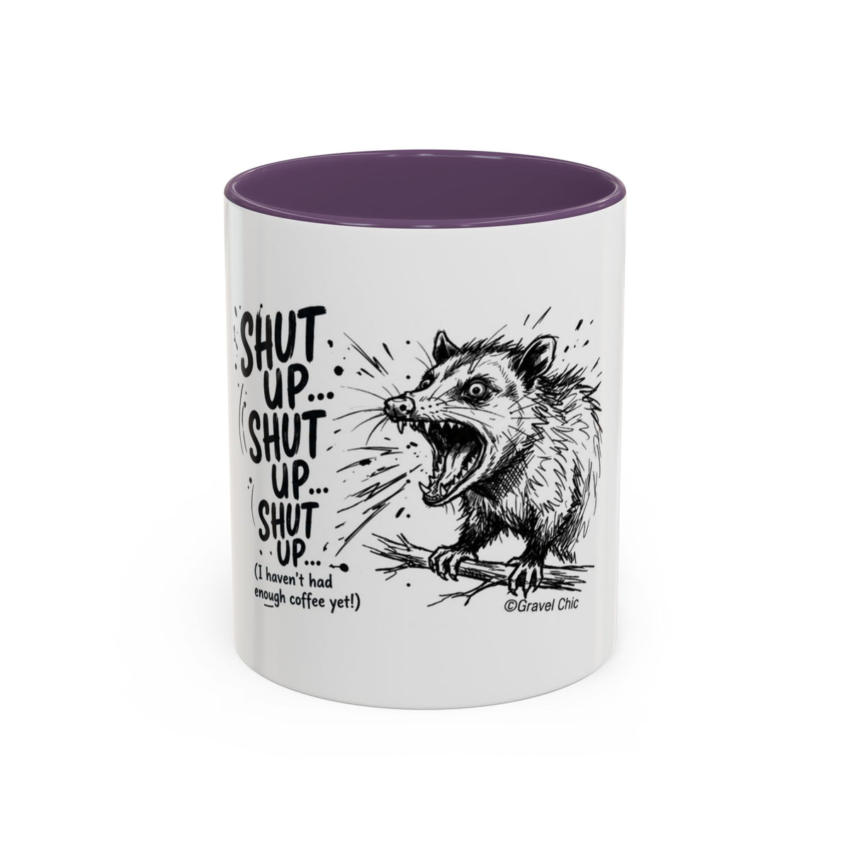 A white ceramic mug with a dark purple interior, featuring a black line art illustration of a snarling opossum and the text 'SHUT UP.
