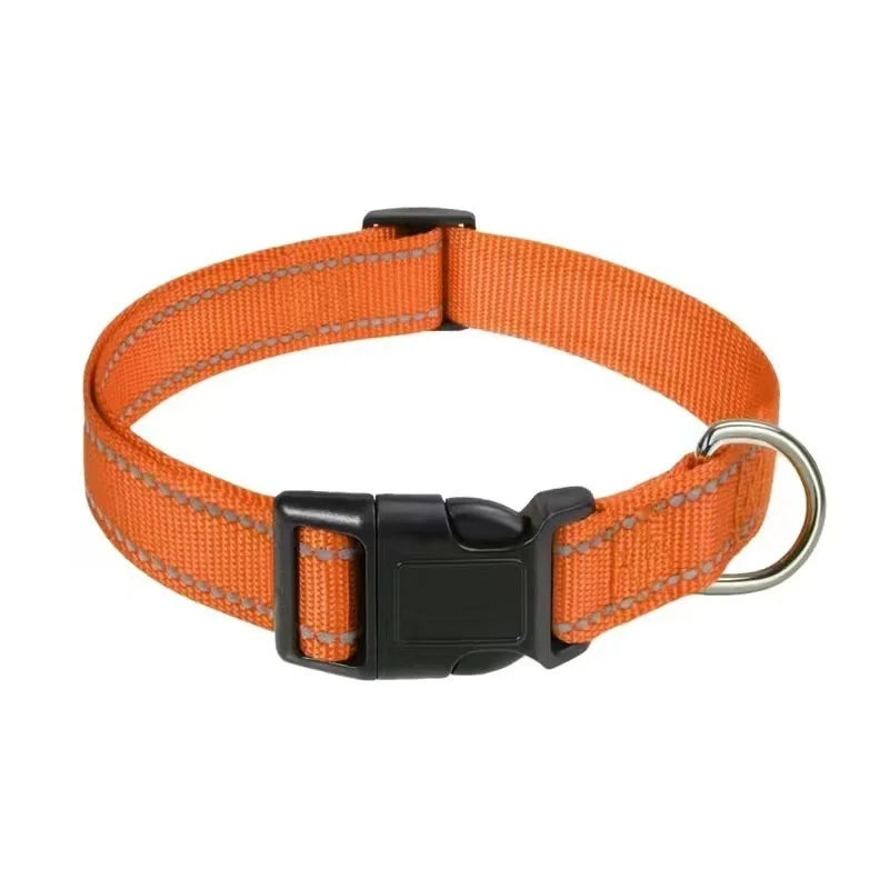 Orange dog collar with a black buckle on a white background