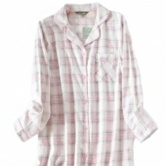 Pink and white plaid shirt on a hanger against a white background