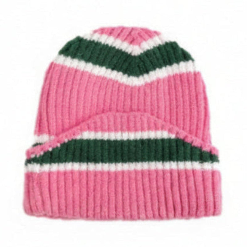 Pink knit beanie with green and white stripes on a white background