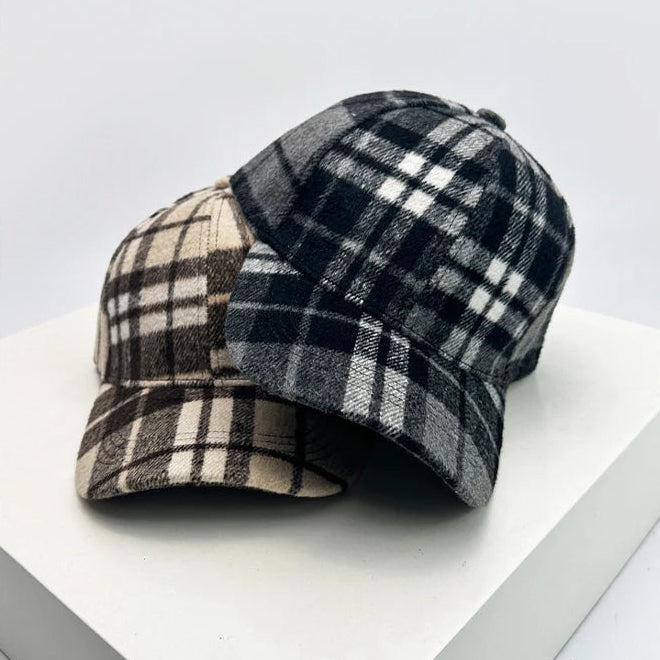 Plaid-patterned caps on a white surface.