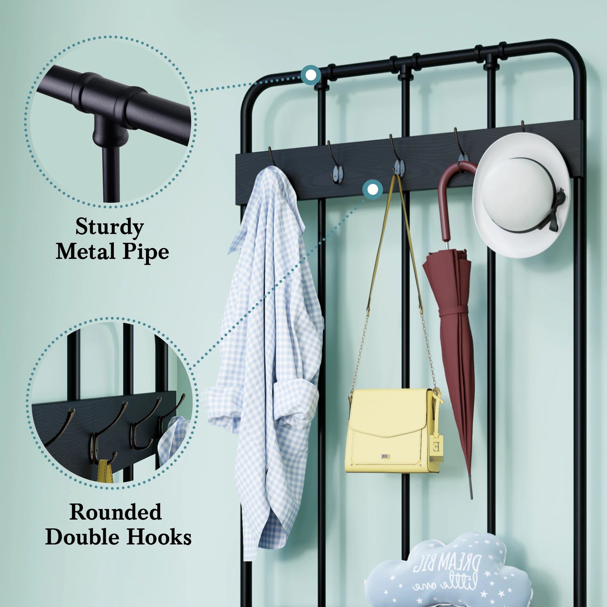 Black metal wall-mounted rack with clothes, umbrella, and bag on a light green background