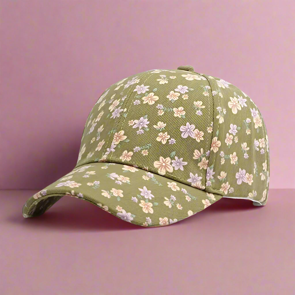 light olive green hat with ditsy floral pattern on a pink surface