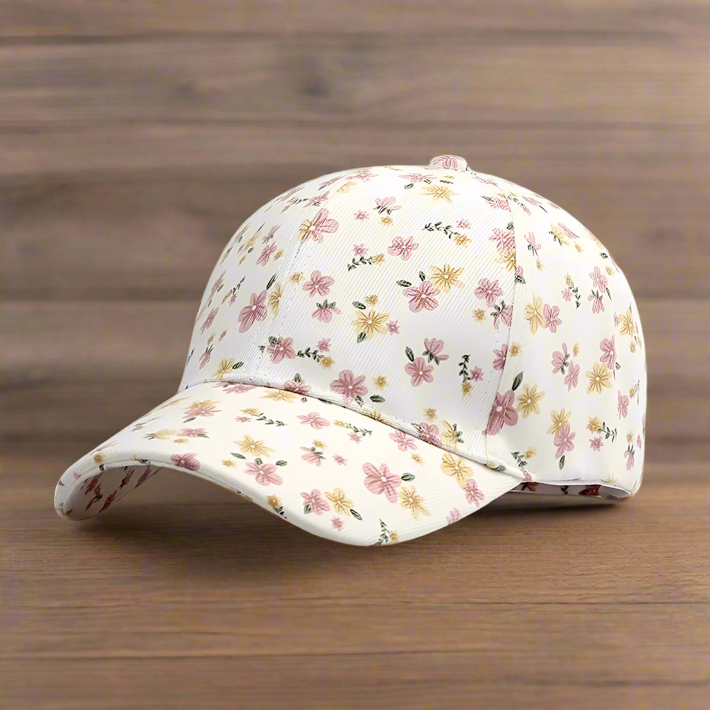 white hat with ditsy floral pattern on a wooden surface