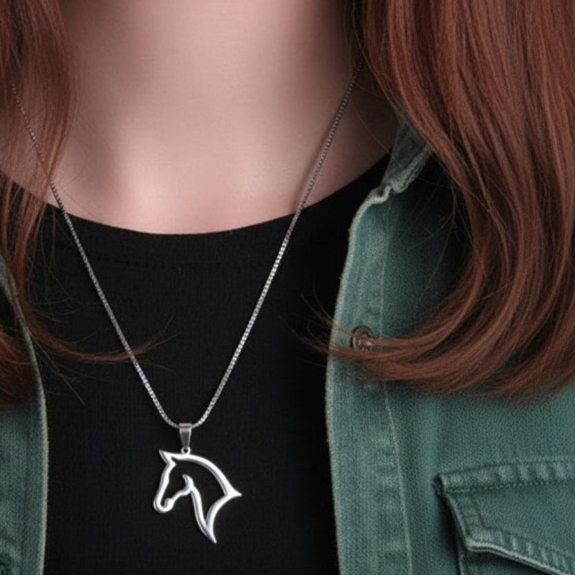 Person wearing a silver horse pendant necklace with a green jacket and black shirt.