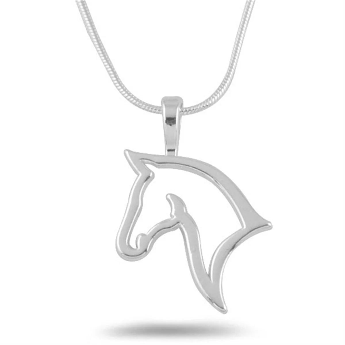 Silver horse head pendant on a white background