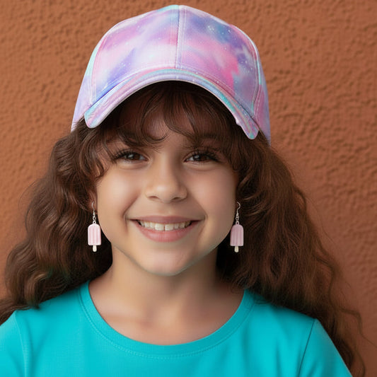 Young girl wearing a colorful cap against a brown wall