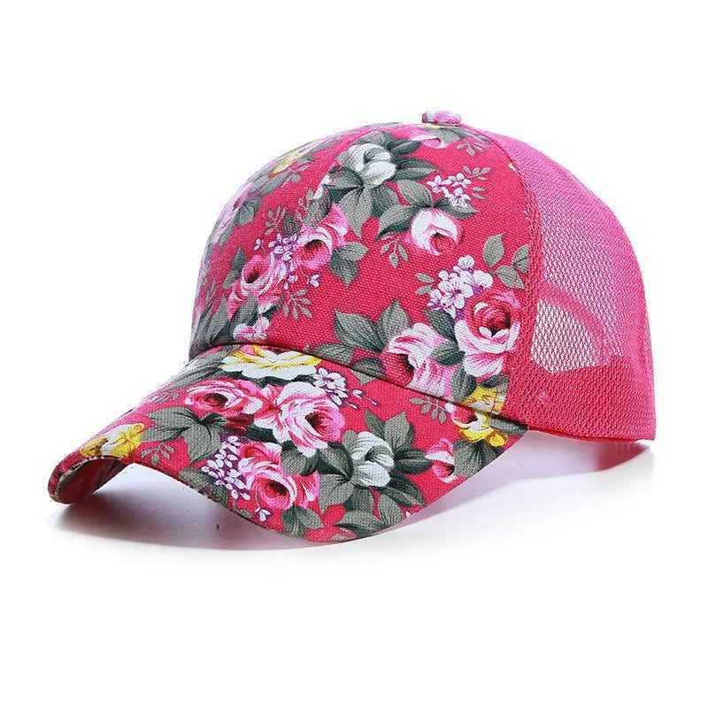 Floral-patterned cap with pink mesh back on a white background