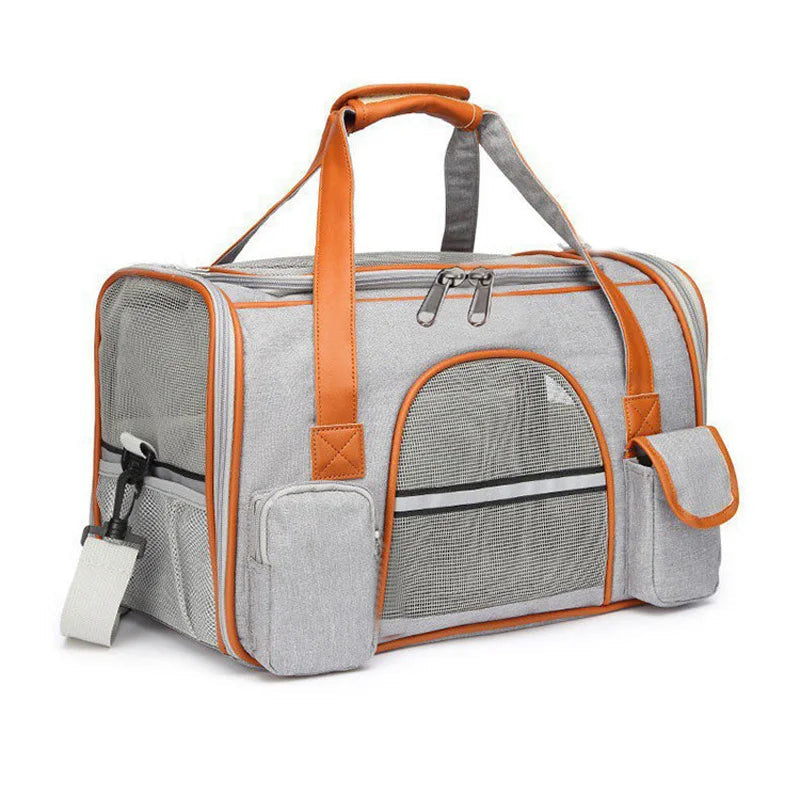 A gray pet carrier duffel bag with leather-like handles and trim.