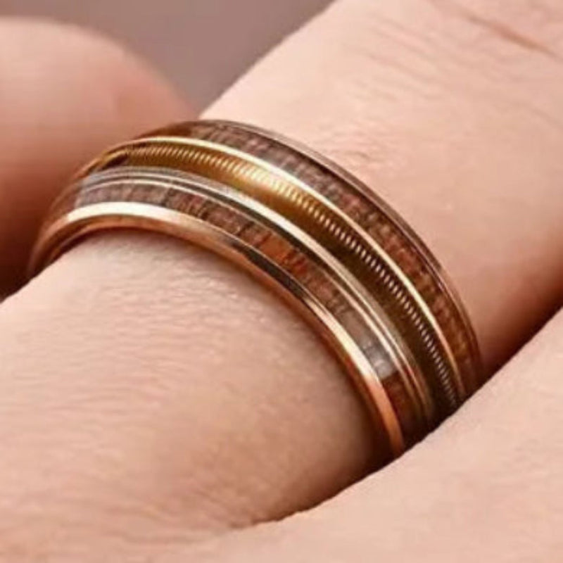 wood inlay ring on a finger close up view